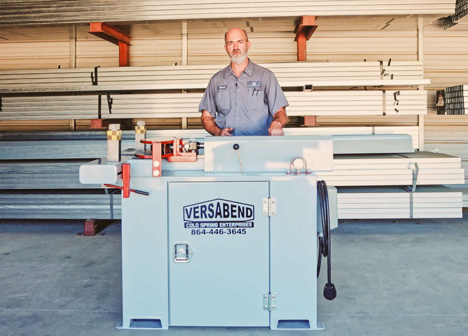man explaining tube bending machine for sale